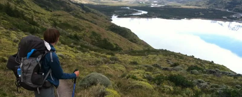 Hiker looking over river in Patagonia
